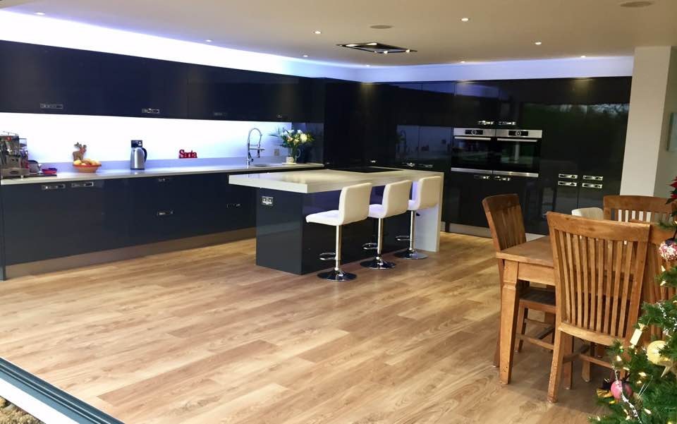 Completed extension — modern open-plan kitchen with dark cabinetry and island